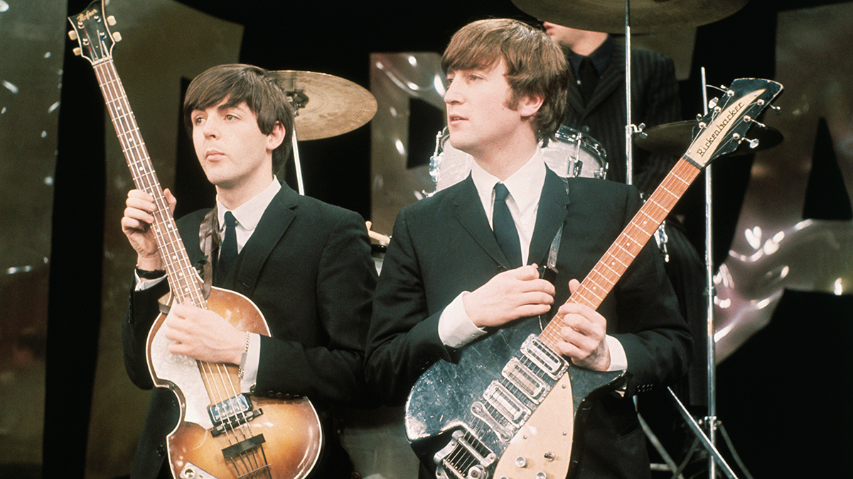 Paul McCartney (left) and John Lennon (1940 - 1980) perform on the set of 'The Ed Sullivan Show' at CBS's Studio 50, New York, New York, February 8, 1964 