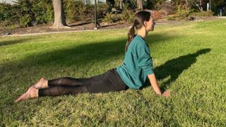 Woman doing the cobra pose stretch