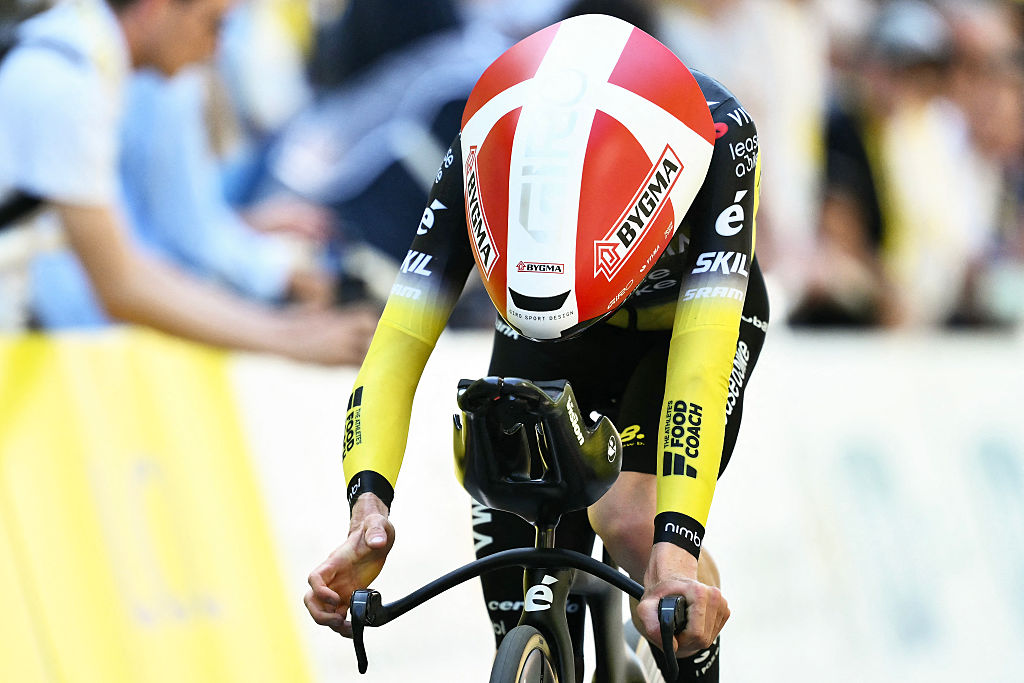 Team Visma - Lease a bike team's Danish rider Jonas Vingegaard cycles to the finish line of the 5th stage of the 112th edition of the Tour de France cycling race, 33 km individual time trial starting and finishing in Caen, northwestern France, on July 9, 2025. (Photo by Marco BERTORELLO / AFP)