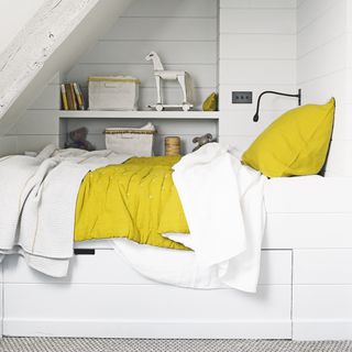 guest room daybed ideas, bespoke daybed crafted in an alcove, loft space, with shelf, storage underneath, yellow quilt and cushion
