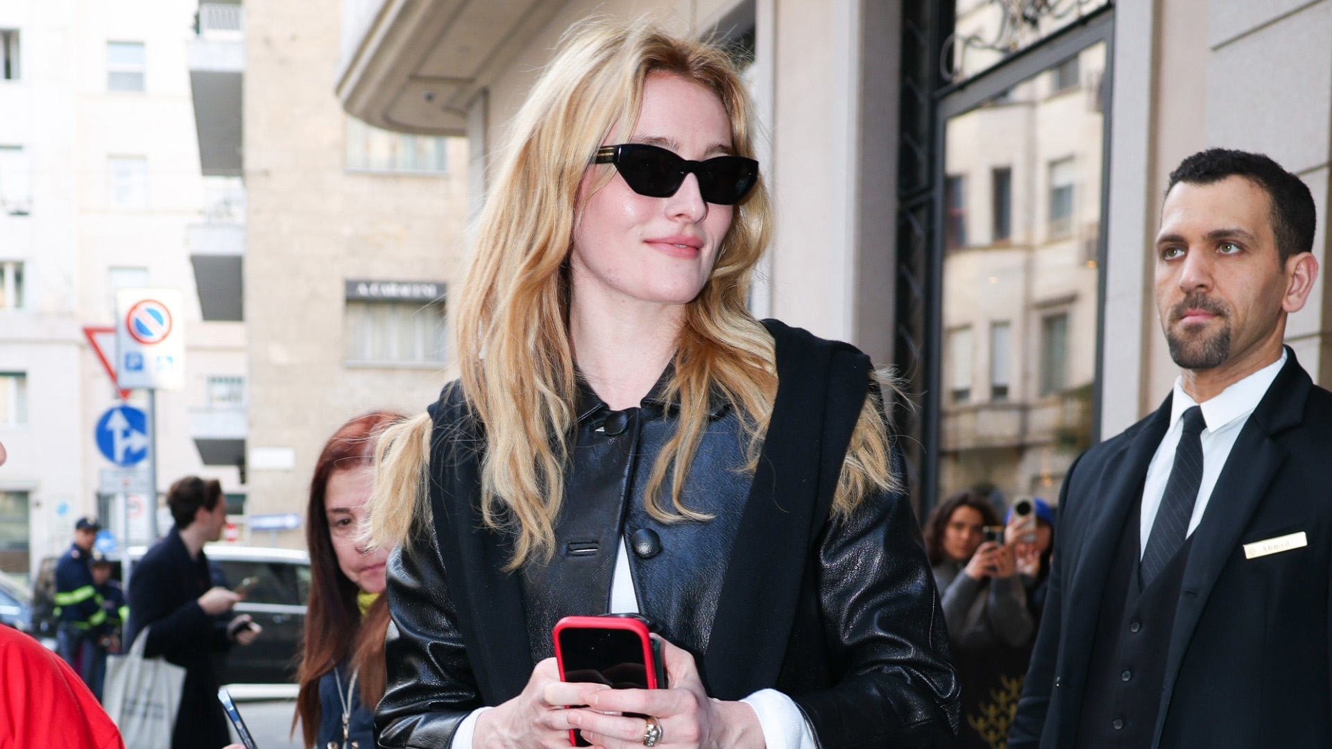 Sarah Pidgeon wearing a leather jacket, white T-shirt, black jeans, and high-vamp shoes during Milan Fashion Week