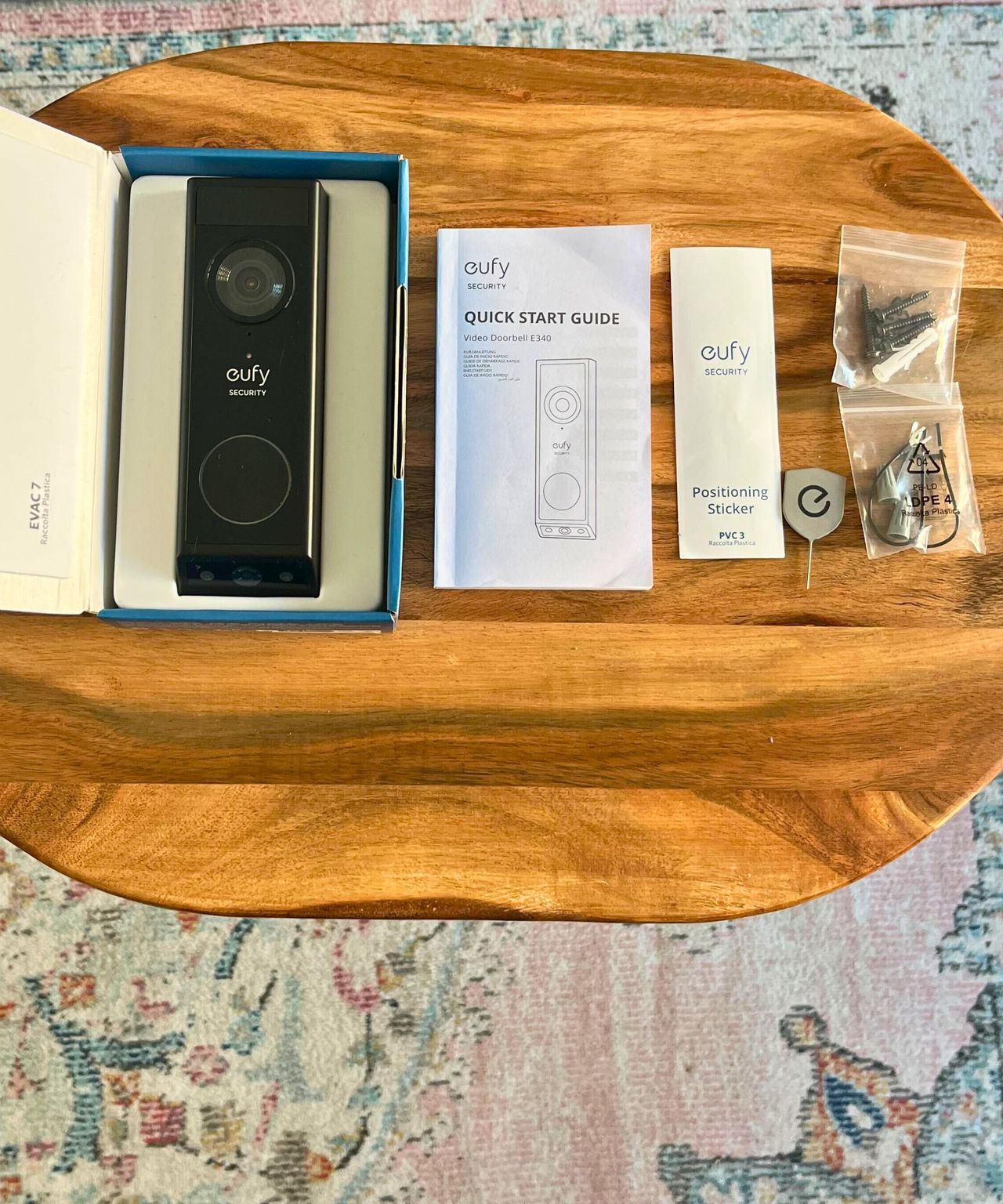 eufy E340 video doorbell box and elements including black video doorbell, quick start guide, positioning sticker, release key, wiring and hardware