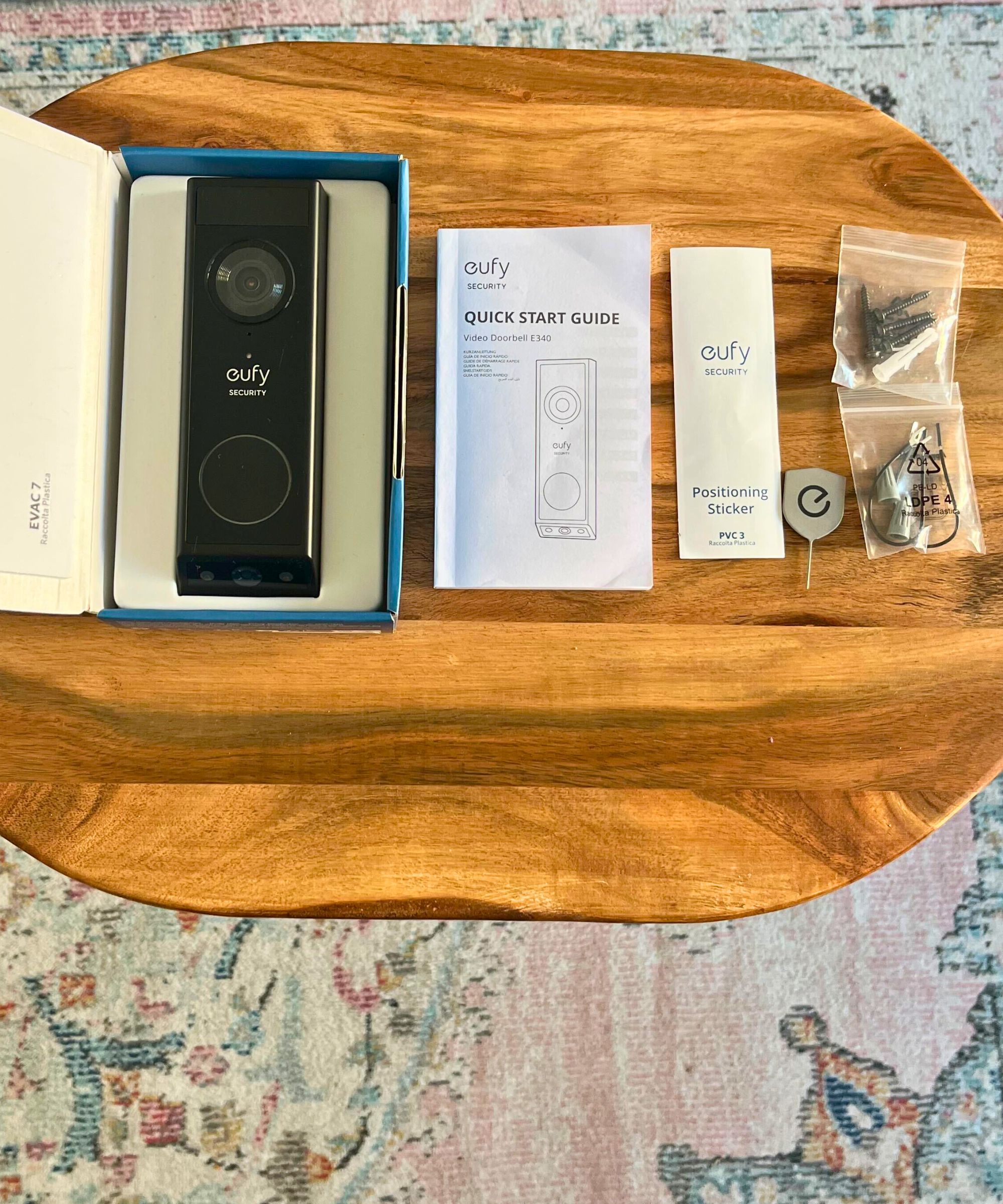 eufy E340 video doorbell box and elements including black video doorbell, quick start guide, positioning sticker, release key, wiring and hardware