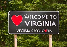 Welcome to Virginia sign with a green forest in the background
