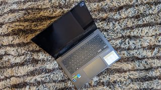 Asus Zenbook 14X OLED laptop on carpet