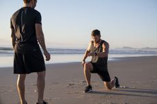 Thor actor Chris Hemsworth training on a beach 