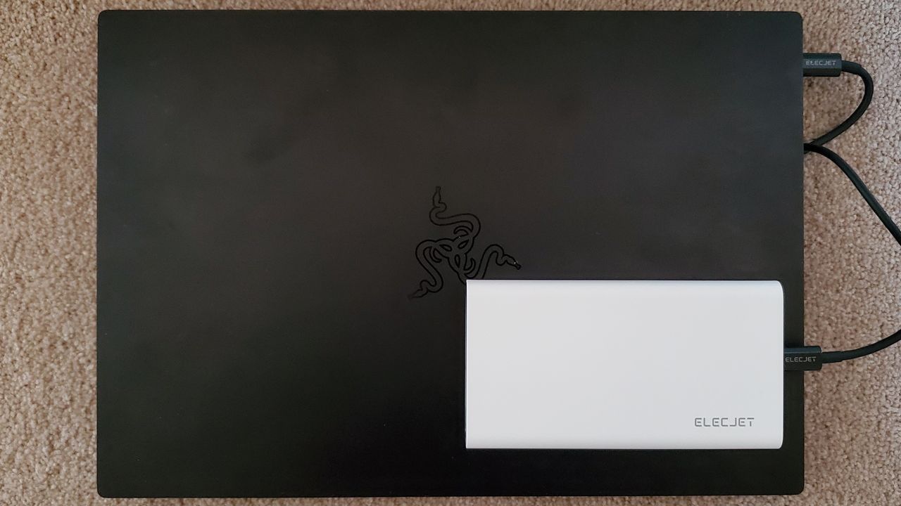 Elecjet Apollo Ultra battery pack charging a Razer Blade Stealth 13 laptop