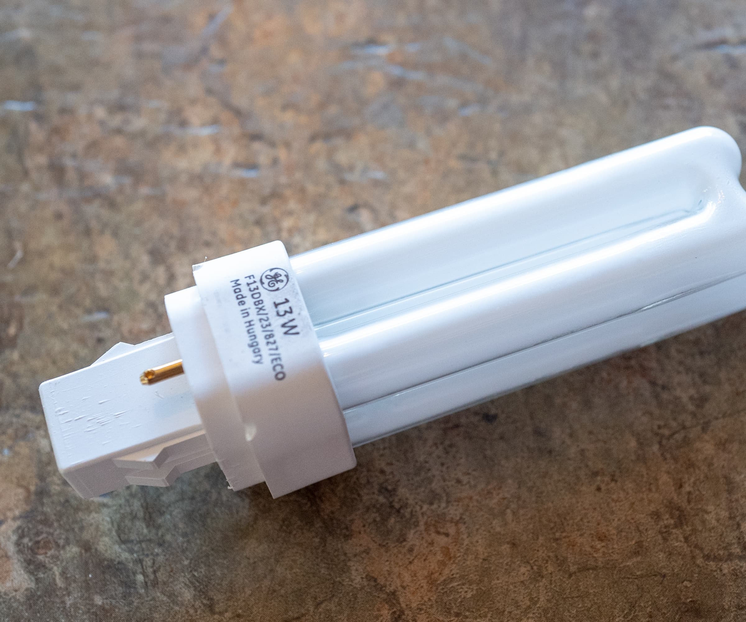 Close-up of General Electric (GE) brand Compact Fluorescent Light (CFL) energy efficient lightbulb