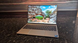 The Dell XPS 13 (2026) laptop pictured on a black marble worktop.