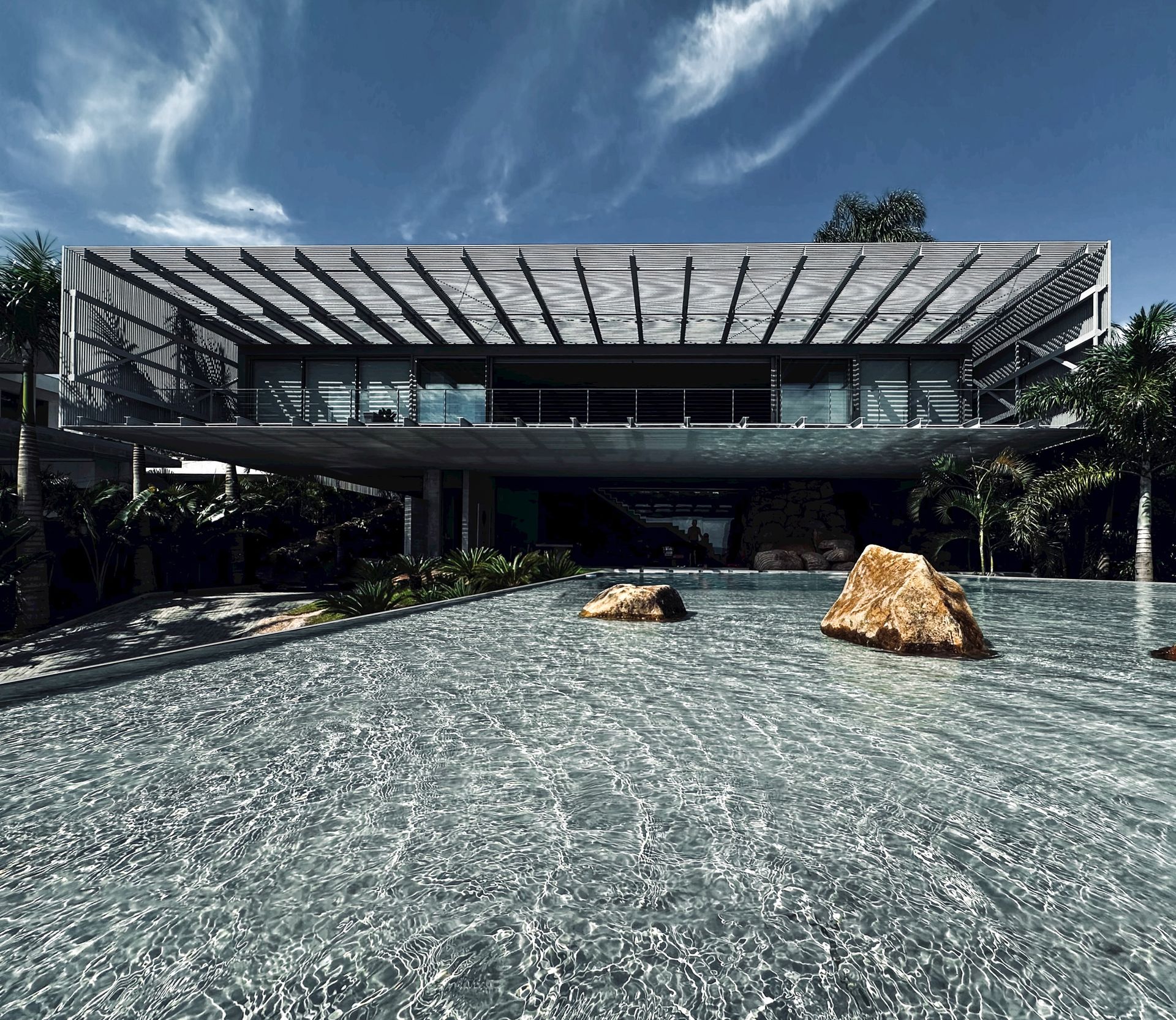 House with blue sky and reflective pool