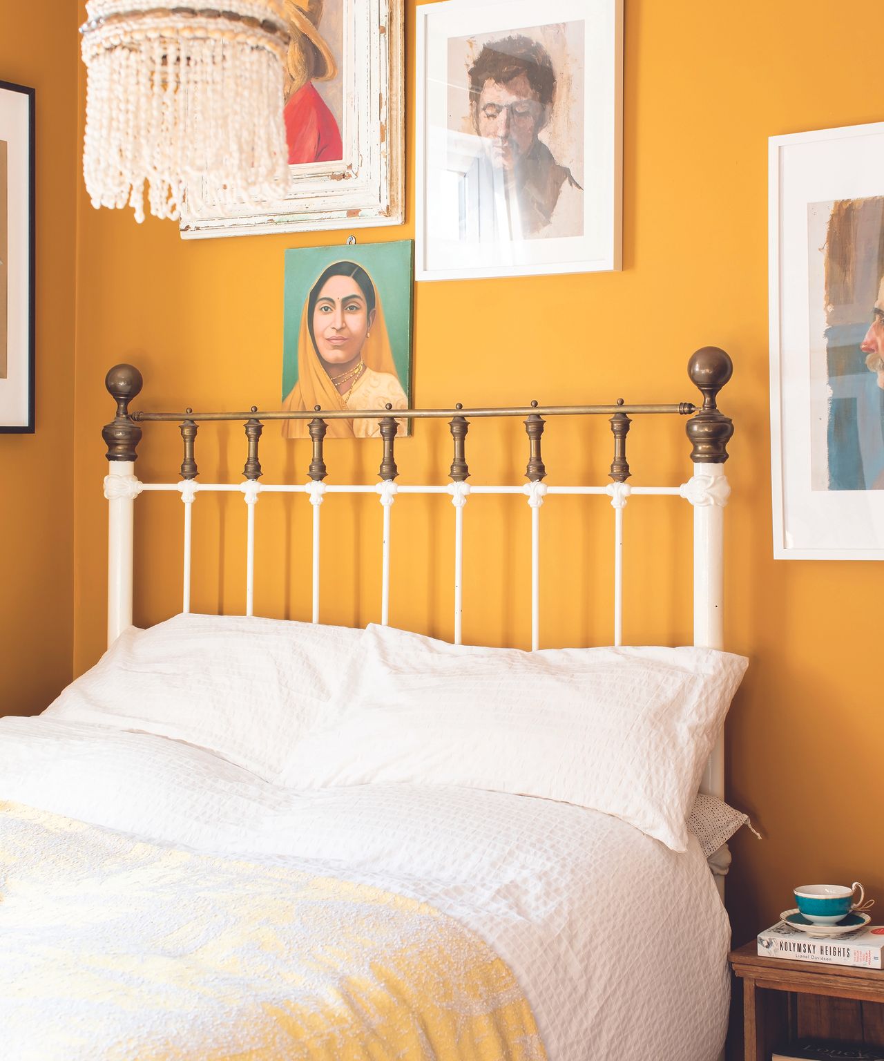 Donaldson yellow bedroom with framed wall art