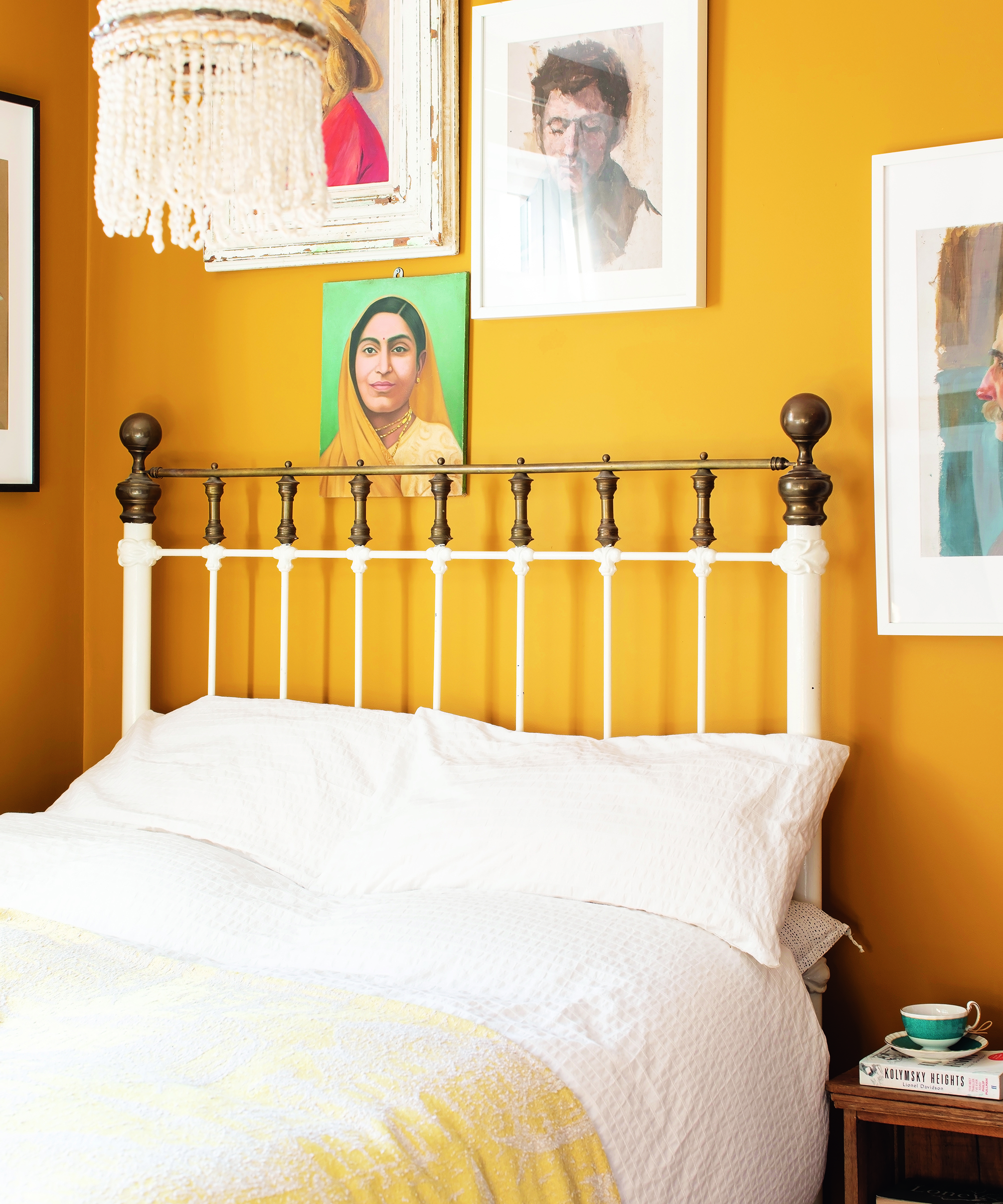 Donaldson yellow bedroom with framed wall art