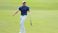 Rory McIlroy watches his shot from the fairway