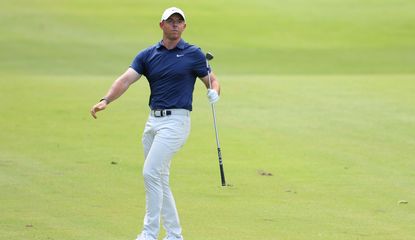 Rory McIlroy watches his shot from the fairway