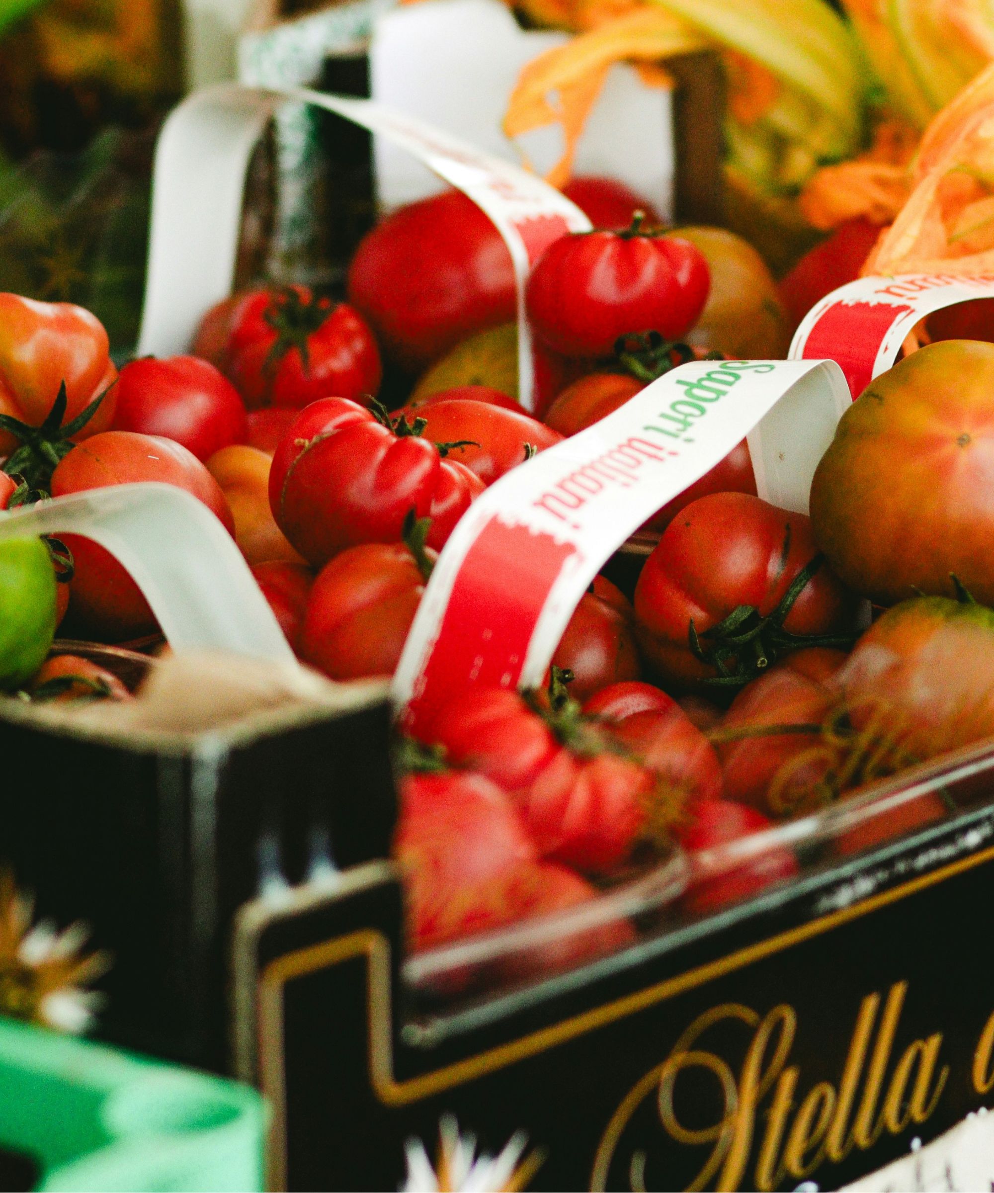 Box of heirloom tomatoes at a farmers market