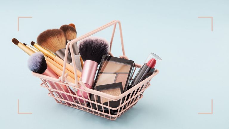 A mini shopping basket filled with beauty products from Sephora UK such as eyeshadow and lipstick