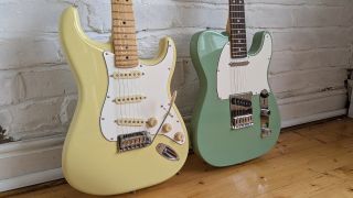 A Fender Player II Stratocaster and Telecaster leaning against a white brick wall