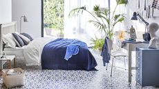 Blue and white bedroom with luxury vinyl tile by Carpetright