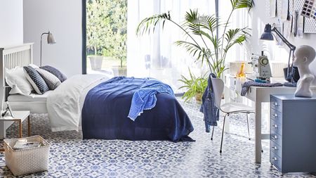 Blue and white bedroom with luxury vinyl tile by Carpetright