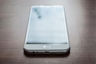 An LG smartphone on a desk