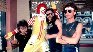 Motorhead with a statue of Ronald MacDonald in 1983