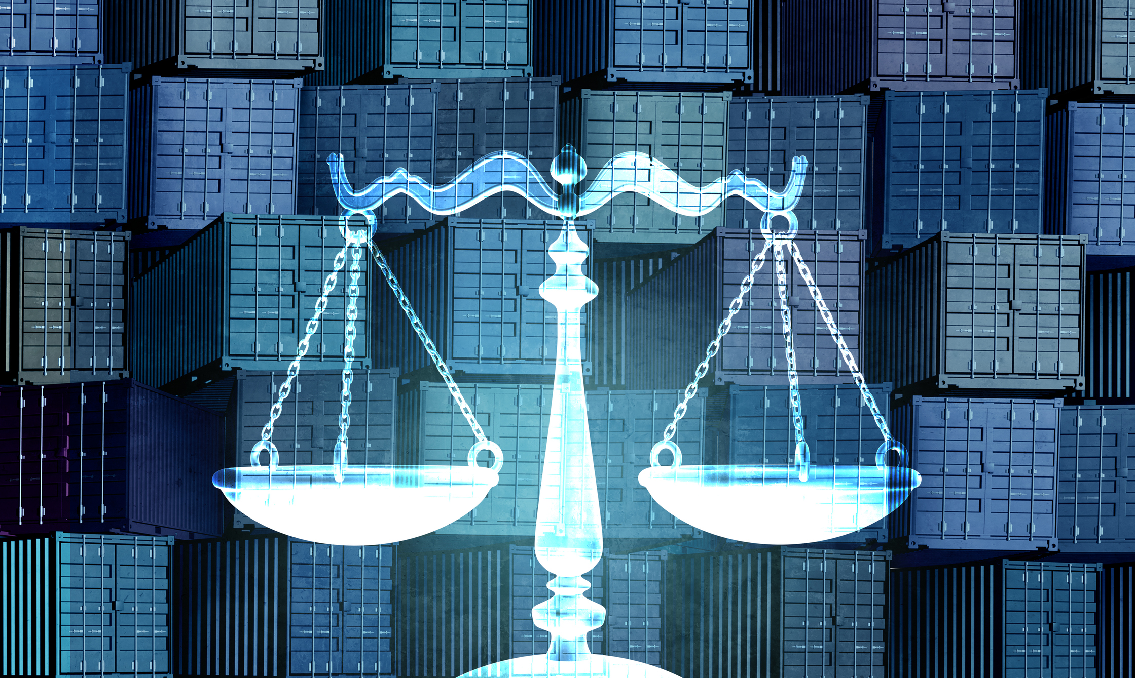 scales of justice in front of cargo boxes