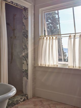 A bathroom with a walk in shower