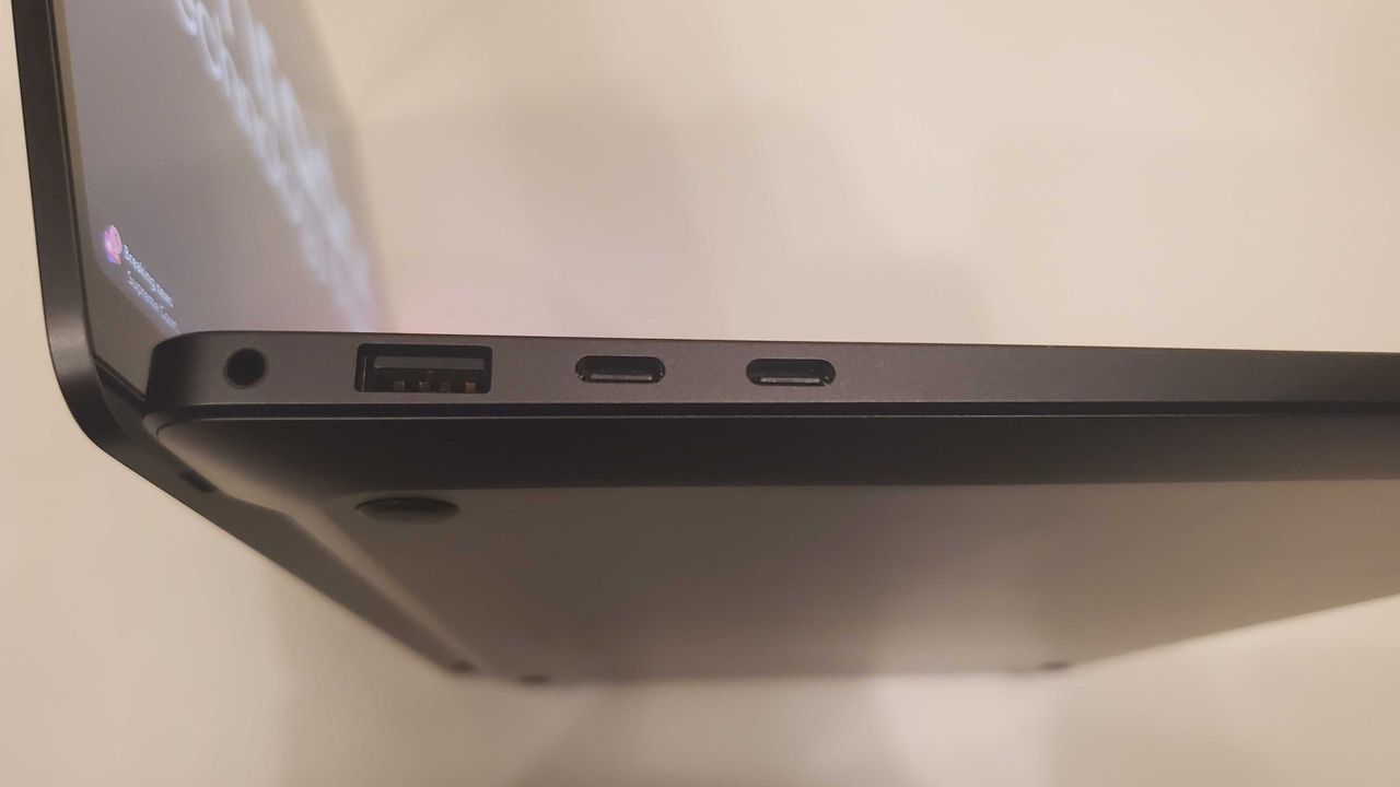 black laptop on white table