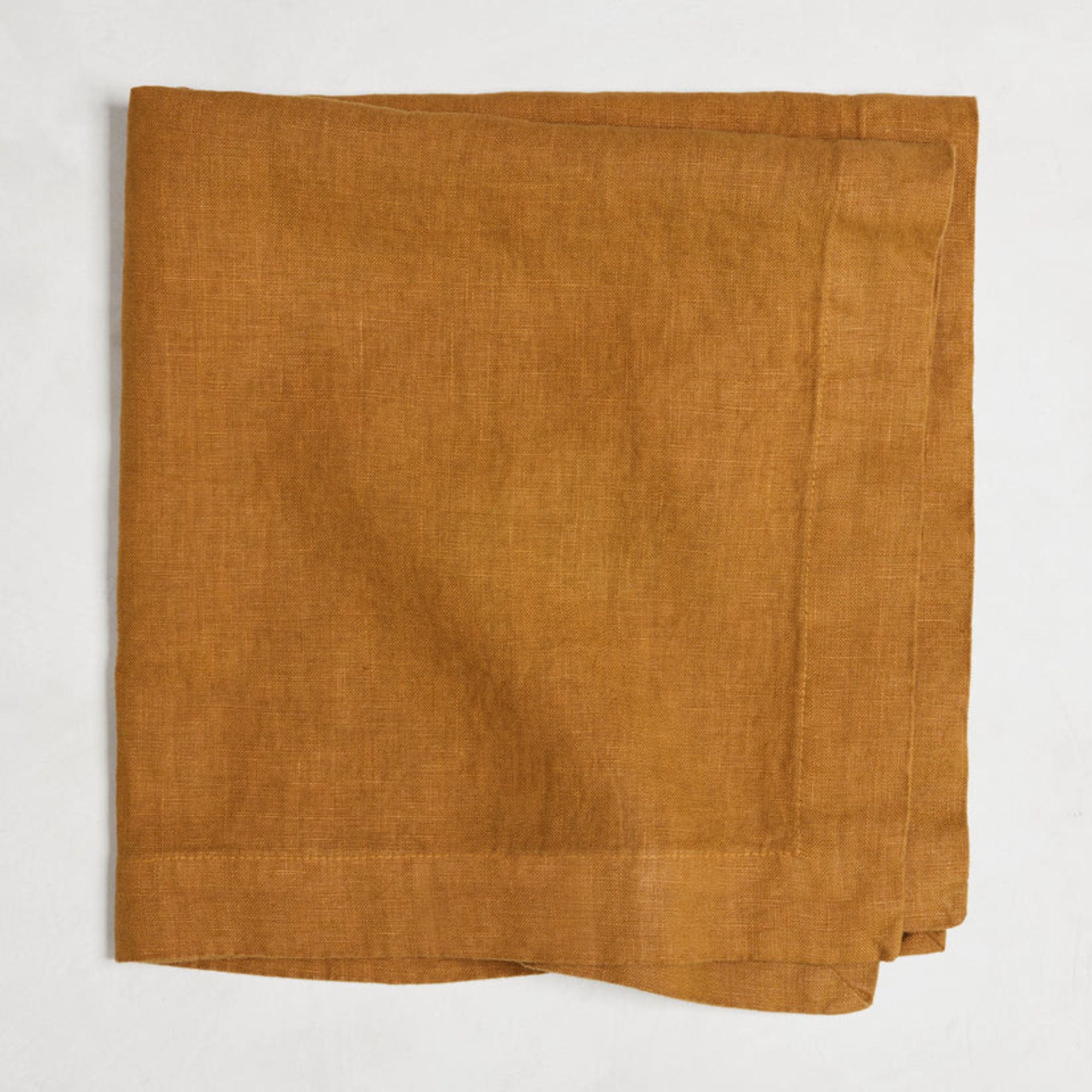 Linen napkin in deep orange shade with wide mitered corners