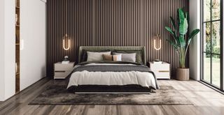 modern bedroom with wood paneling and wall of bespoke built in wardrobes to show how to make your bedroom feel like a luxury hotel by hiding clutter
