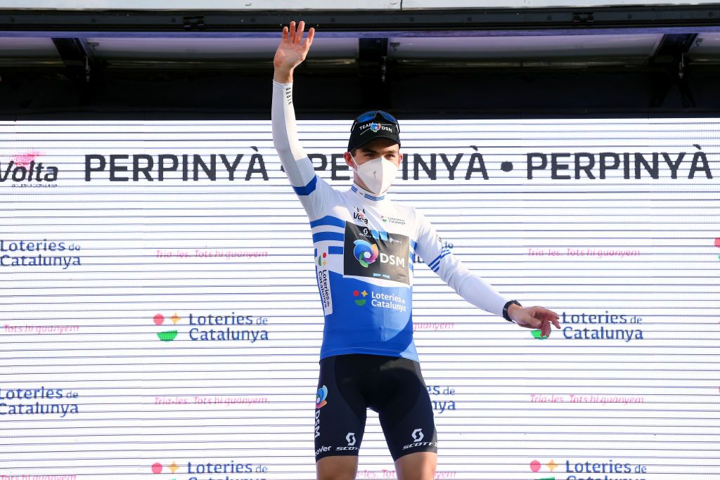 PERPIGNAN FRANCE MARCH 22 Jonas Iversby Hvideberg of Norway and Team DSM celebrates winning the blue points jersey in the podium ceremony after the 101st Volta Ciclista a Catalunya 2022 Stage 2 a 2024km stage from LEscala to Perpignan VoltaCatalunya101 WorldTour on March 22 2022 in Perpignan France Photo by David RamosGetty Images