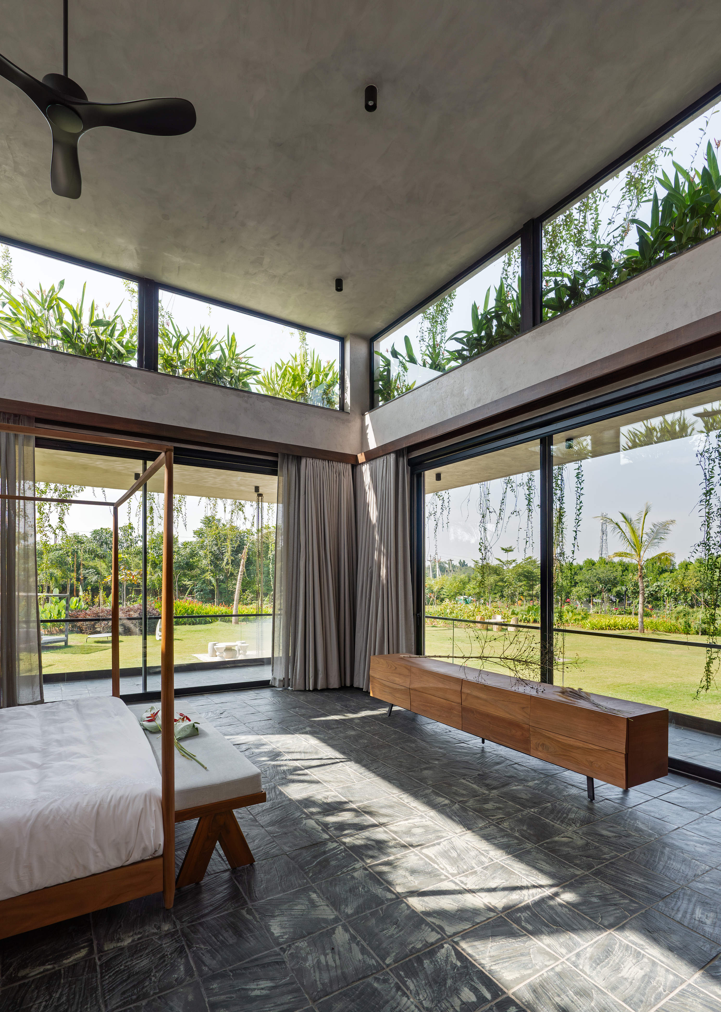 hyderabad home in brutalist style covered in greenery by 23 Degrees Design Shift