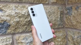 The back of the Realme GT Master Edition against a wall.