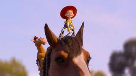 Jessie smiling while on a horse's head in Toy Story 5