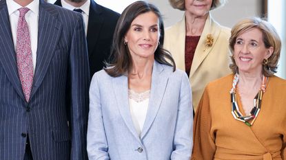 Queen Letizia of Spain in a blue linen suit with white sneakers at a board meeting with the Patronage of the Gallery of the Royal Collections in Madrid, Spain May 2024