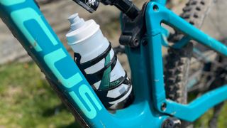 Bottle in Elite Prism bottle cage on mountain bike