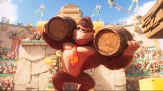 Donkey Kong (Seth Rogen) holding two wooden barrels in The Super Mario Bros. Movie