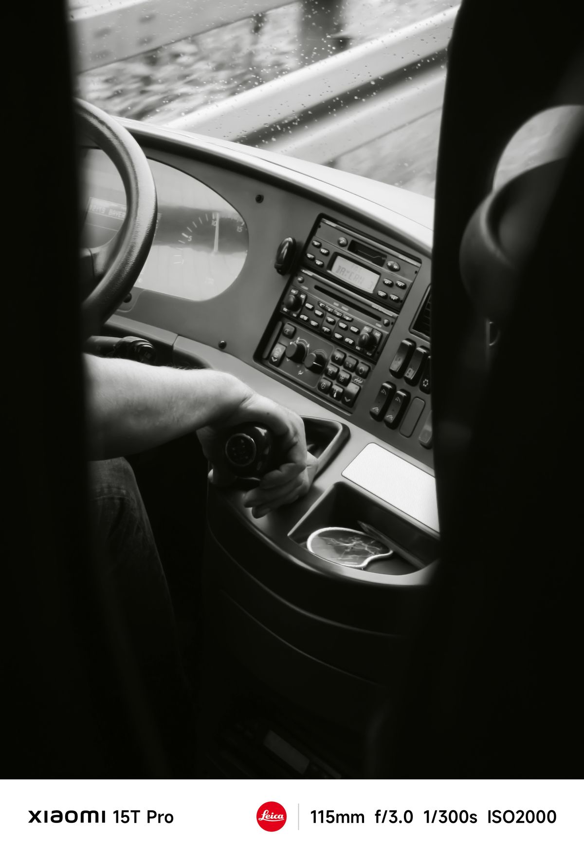 A driver moving a gear stick on a bus