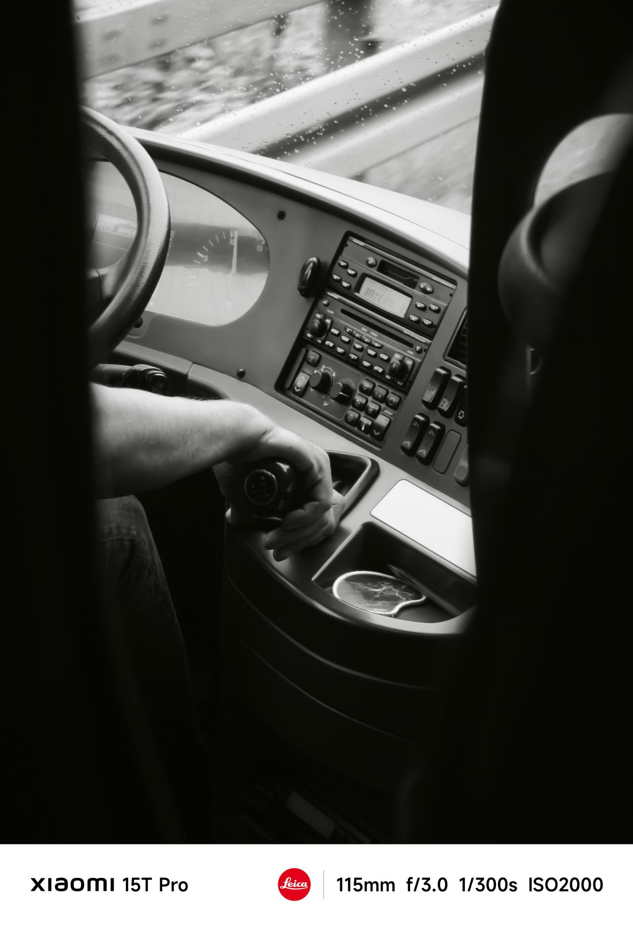 A driver moving a gear stick on a bus