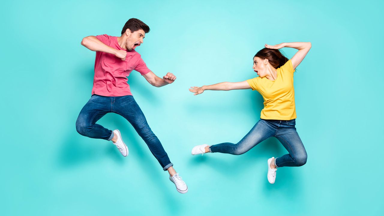 A man and a woman fighting