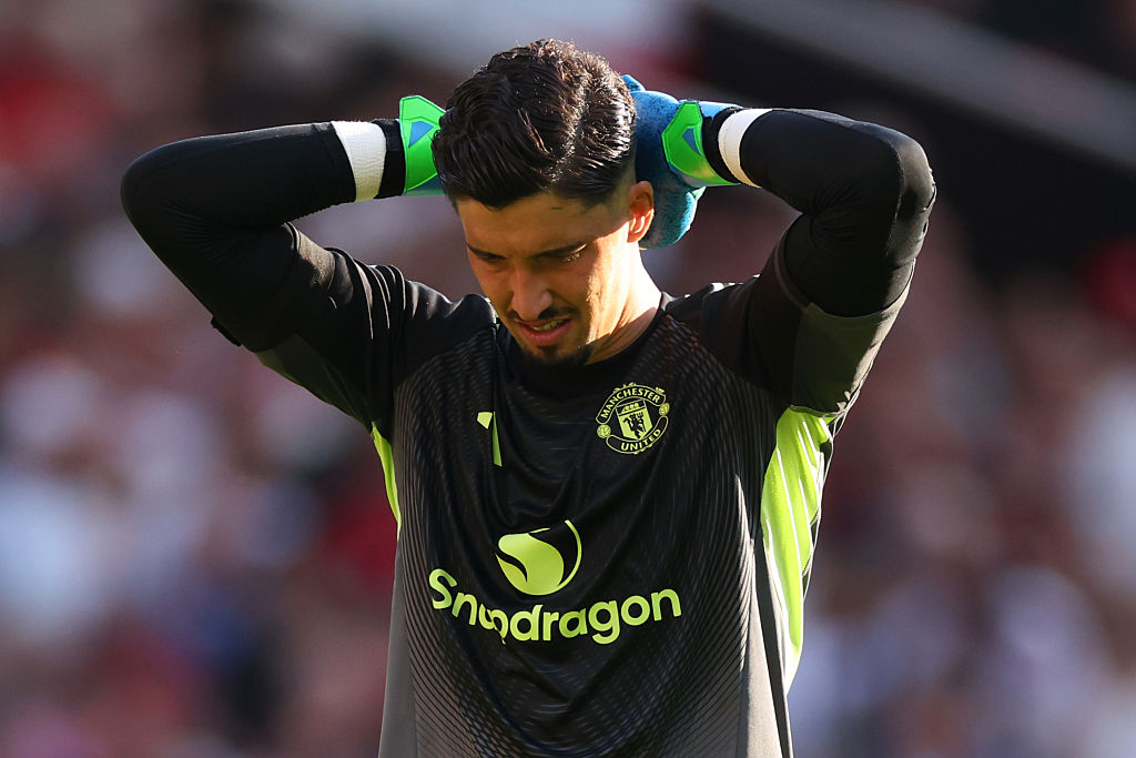 Altay Bayindir of Manchester United looks dejected during the Premier League match between Manchester United and Arsenal at Old Trafford on August 17, 2025 in Manchester, England.
