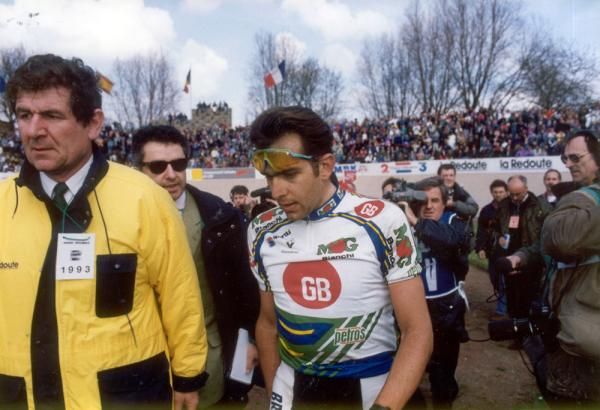 Franco Ballerini is escorted to the Paris-Roubaix podium after finishing second to Gilbert Duclos-Lassalle in 1993