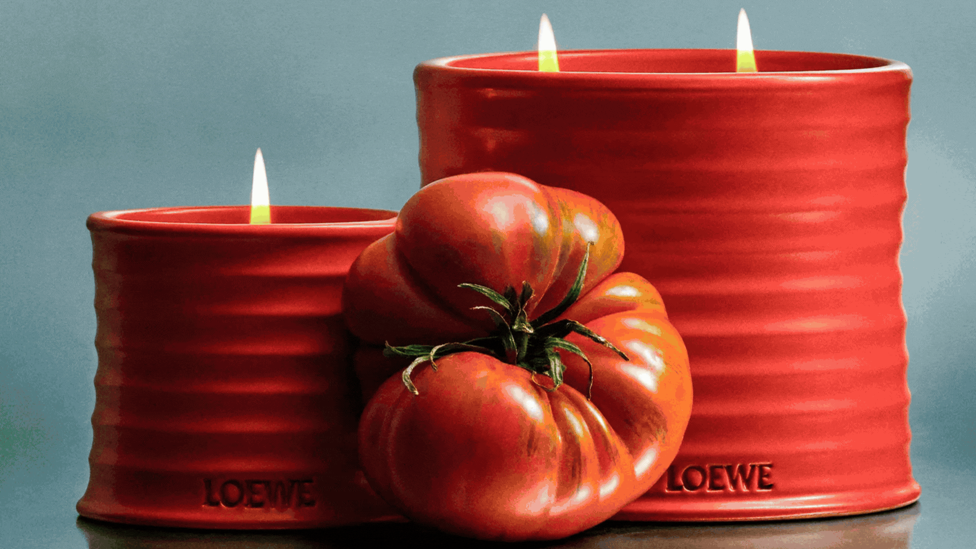 A GIF of scented candles from Loewe, Earl of East, MALIN+GOETZ, ferm Living, and Diptyque