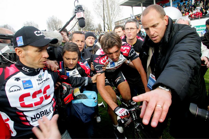 Fabian Cancellara is helped by his CSC team in 2006 after his first Roubaix victory