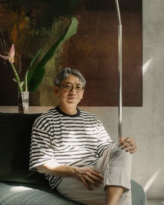 Ian Chee's Singapore apartment showing portrait of the owner sat in a chair