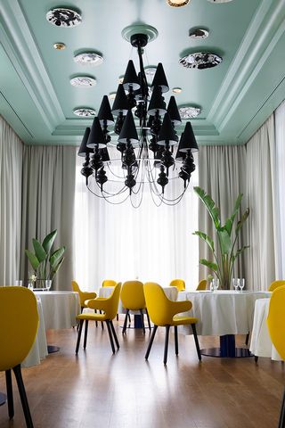 A black chandelier at the Jaime Hayon-redesigned La Terraza del Casino restaurant, Madrid, Spain