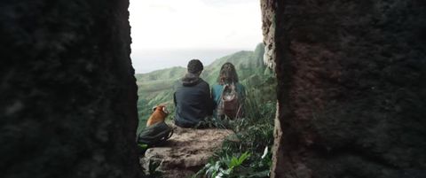 Will, Lyra, and Pan sit overlooking a beautiful gorge