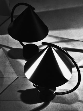 Black and white photograph of a table lamp by Ferm Living