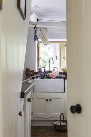 Butlers sink in utility room in grade II listed thatched cottage
