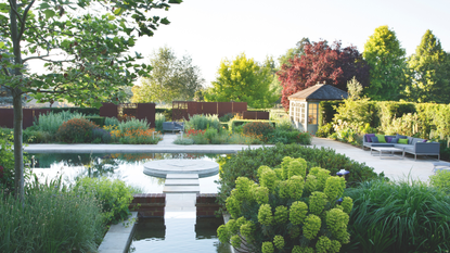 a large backyard with a pool and lots of greenery